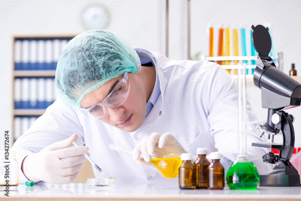 Pharmaceutical industry concept with scientist in the lab Pharmaceutical industry concept with scientist in the lab