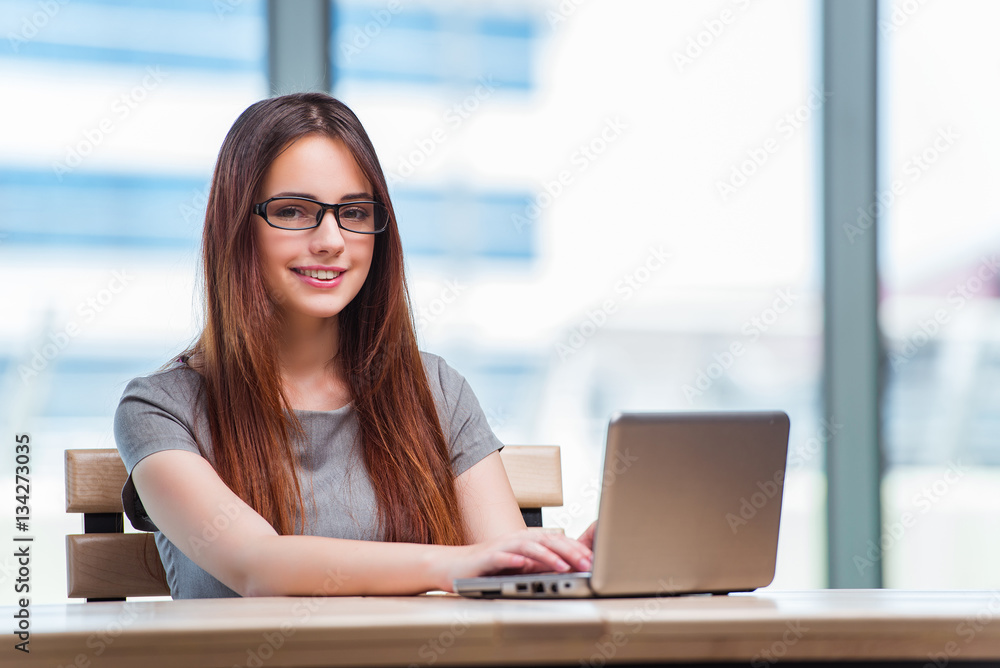 Young businesswoman working on laptop Young businesswoman working on laptop