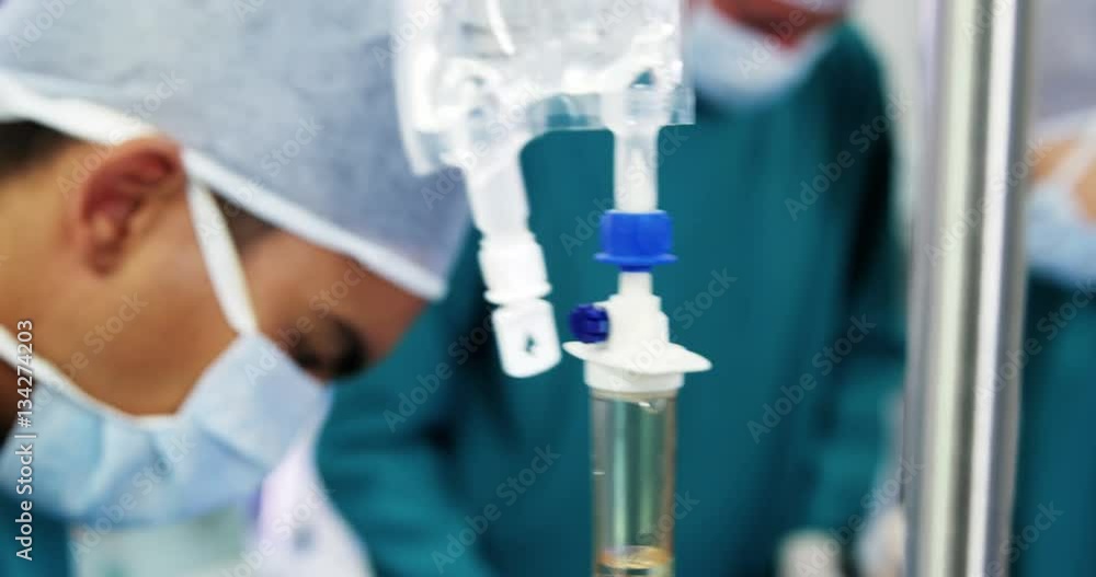 Surgery team operating a patient in an operating room Surgery team operating a patient in an operating room