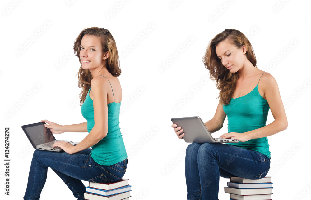 Student with netbook sitting on books Student with netbook sitting on books