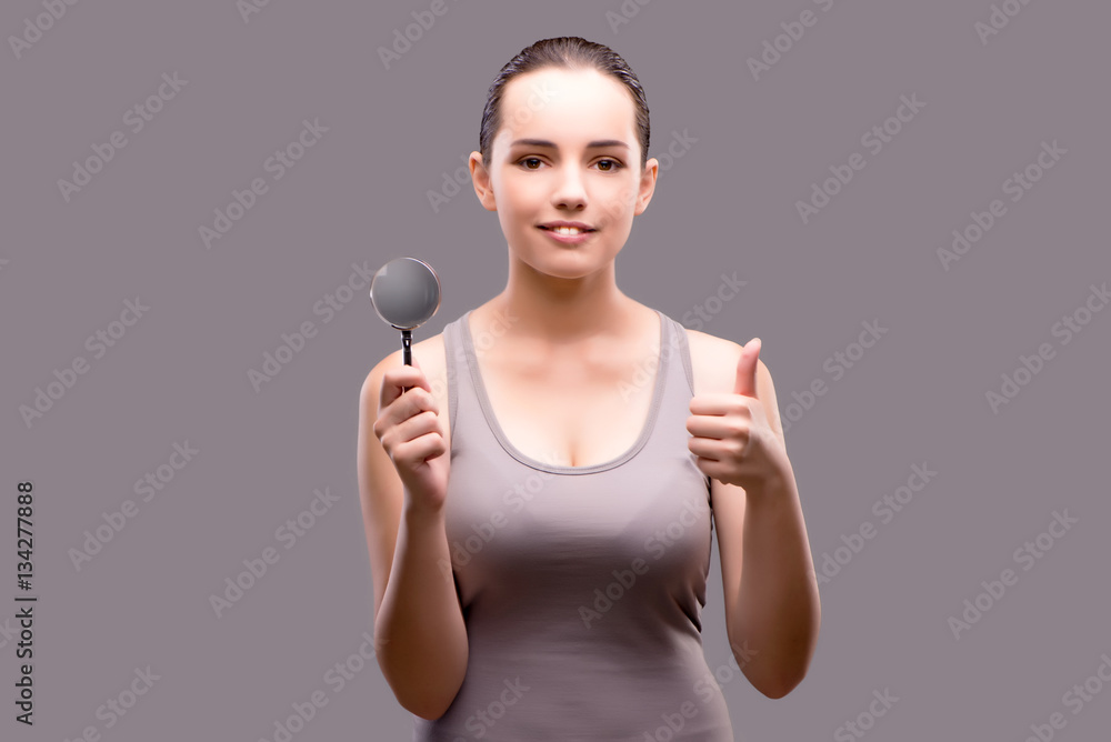 Young girl with magnifying glass
