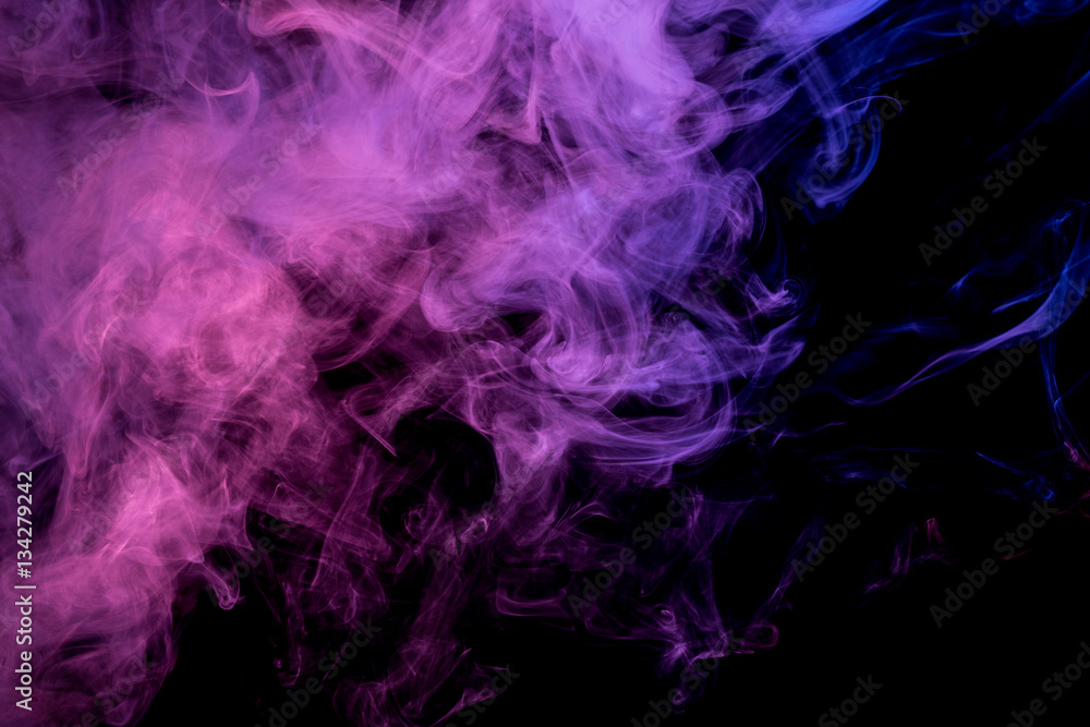 Abstract smoke Weipa. Personal vaporizers fragrant steam. The concept of alternative non-nicotine smoking. Blue lilac smoke on a black background. E-cigarette. Evaporator. Taking Close-up. Vaping.