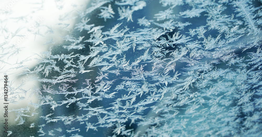 Fototapeta premium frost crystal on window glass in winter season