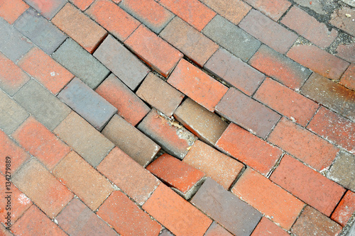 red brick footpath pavement sidewalk damaged
