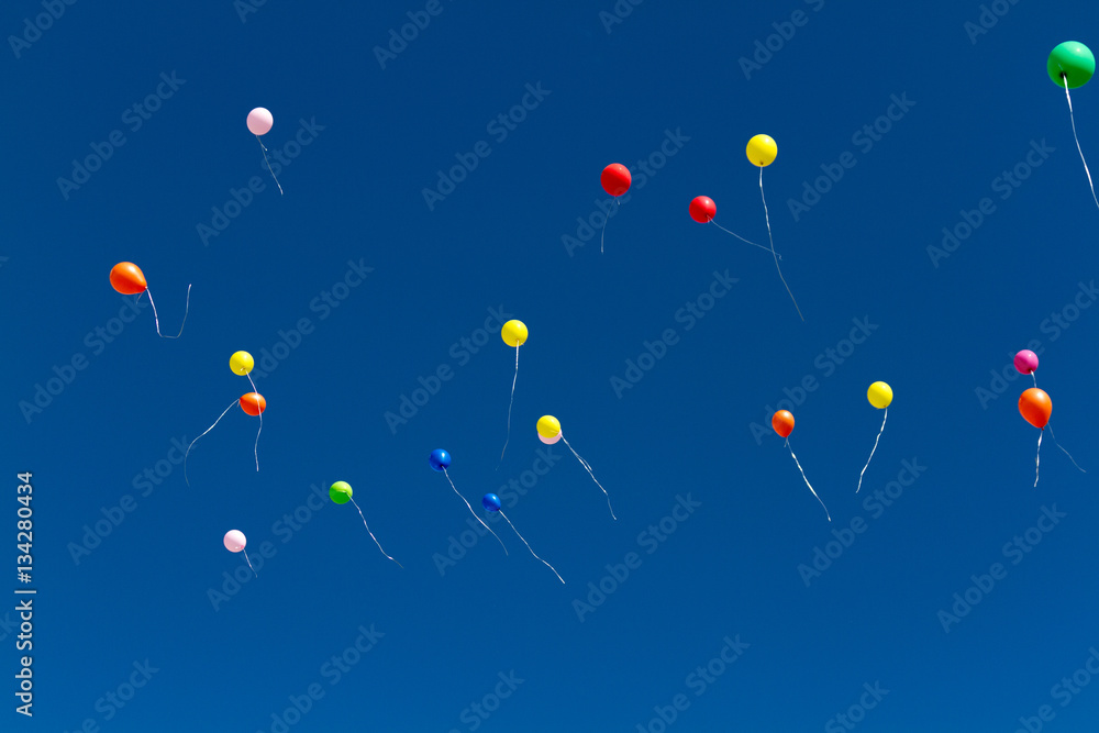 many bright baloons in the blue sky many bright baloons in the blue sky