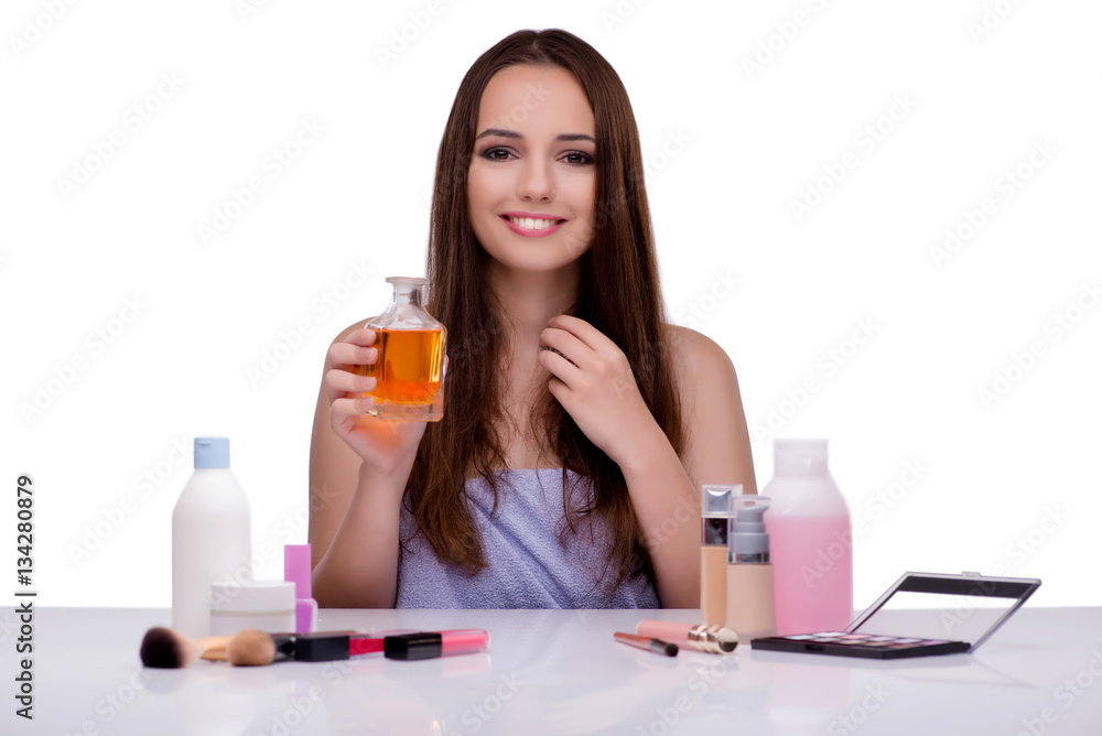 Woman doing makeup isolated on white Woman doing makeup isolated on white