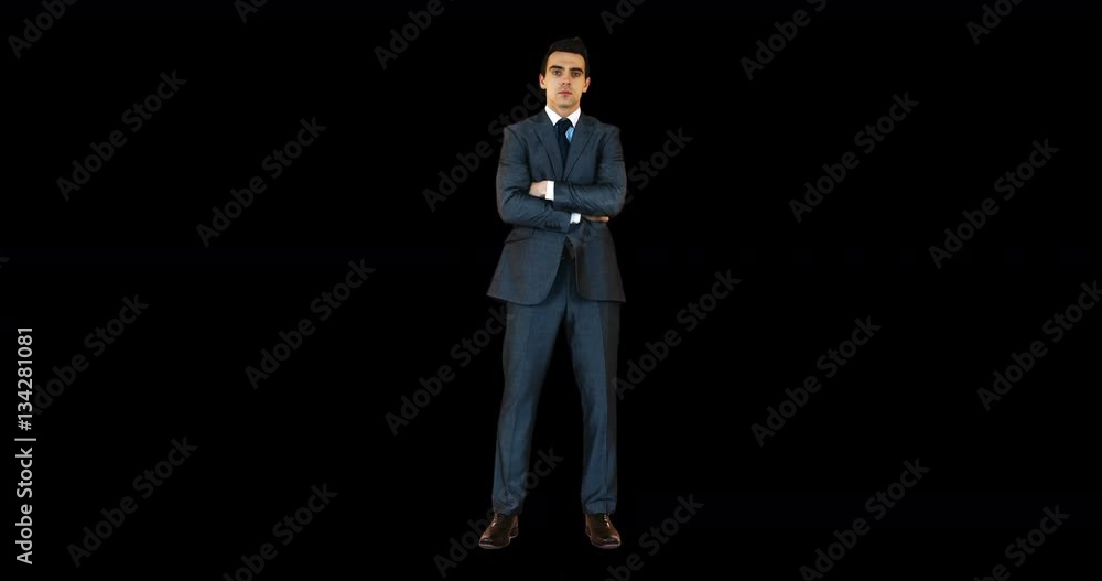 Young businessman standing with arms crossed Young businessman standing with arms crossed