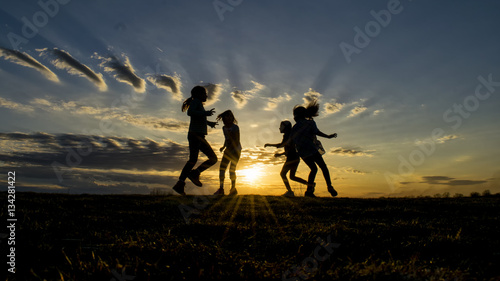 Children playing in the setting sun © tater1979