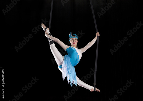 Young woman circus air gymnast