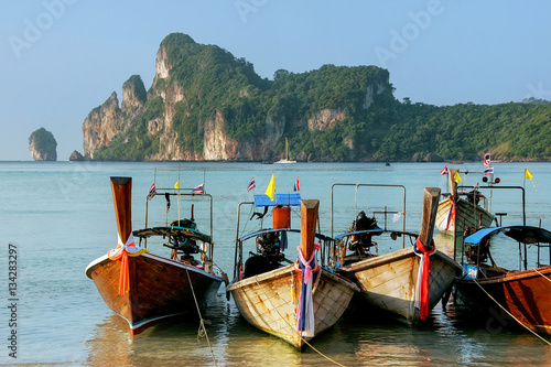 Longtail boats anchored at Ao Loh Dalum beach on Phi Phi Don Isl © donyanedomam