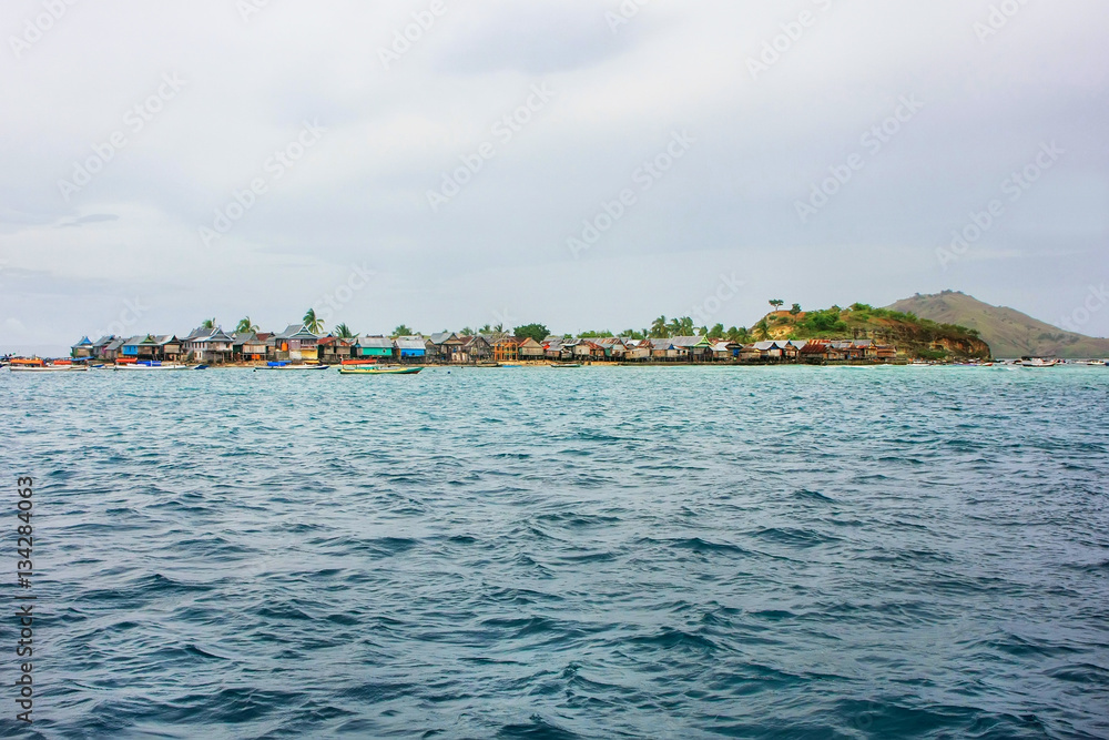 Small island with typical village in Komodo National Park, Nusa