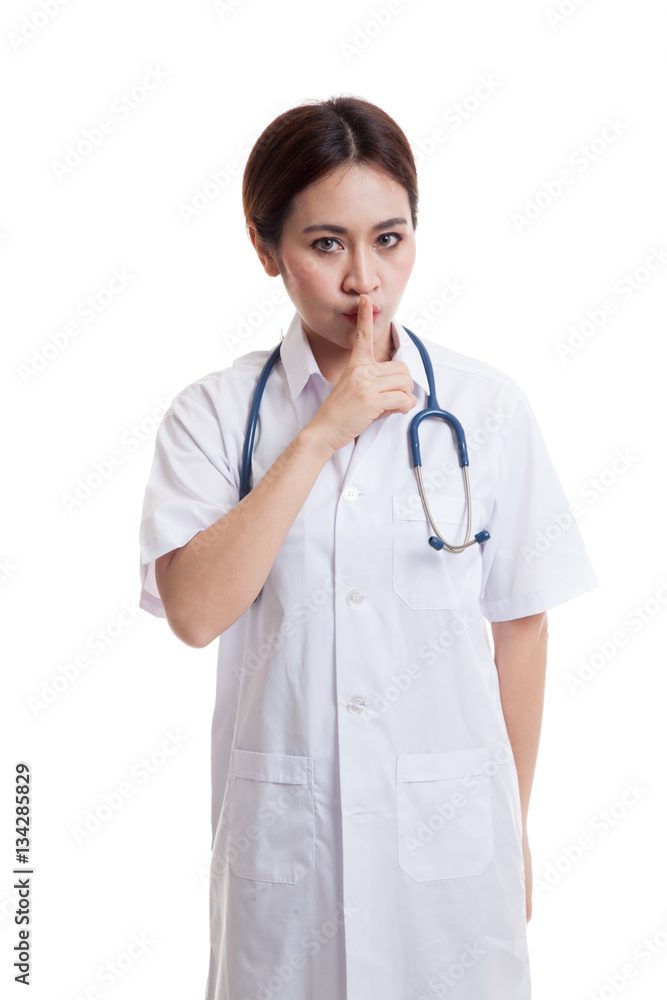 Asian young female doctor do quiet sign. Asian young female doctor do quiet sign.