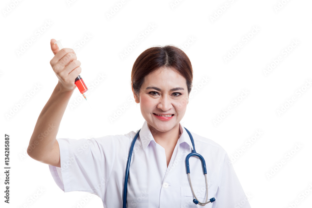 Crazy Young Asian female doctor hold a syringe. Crazy Young Asian female doctor hold a syringe.
