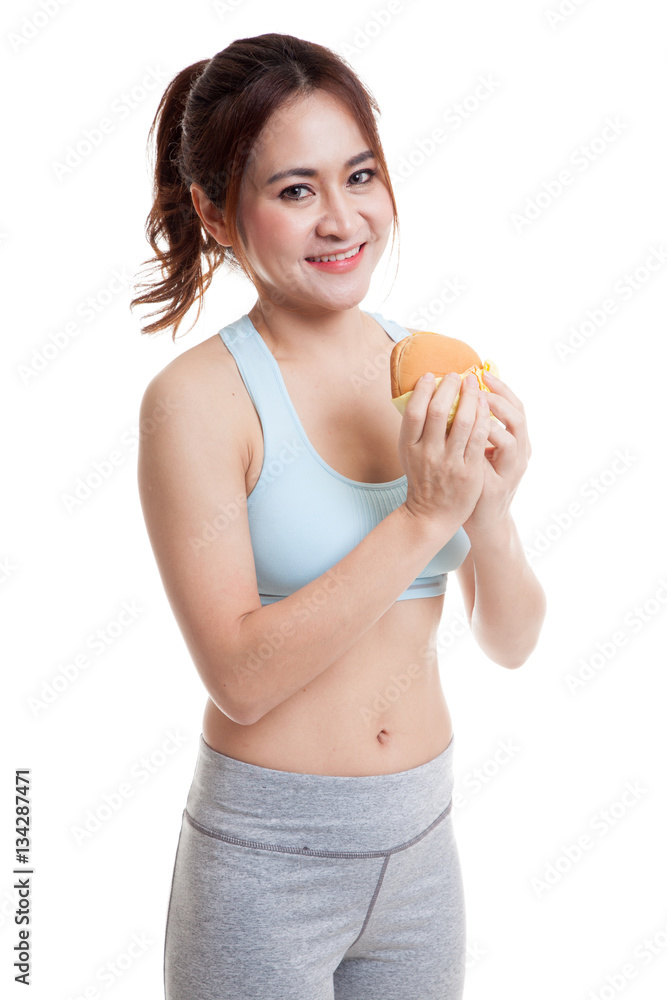 Beautiful Asian healthy girl enjoy eating hamburger. Beautiful Asian healthy girl enjoy eating hamburger.