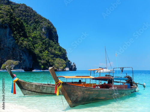 Longtail boats anchored at Ao Yongkasem beach on Phi Phi Don Isl © donyanedomam