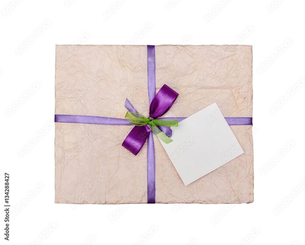 The lilac gift which is elegantly packed into crumpled paper, with the place for your text, isolated on white The lilac gift which is elegantly packed into crumpled paper, with the place for your text, isolated on white