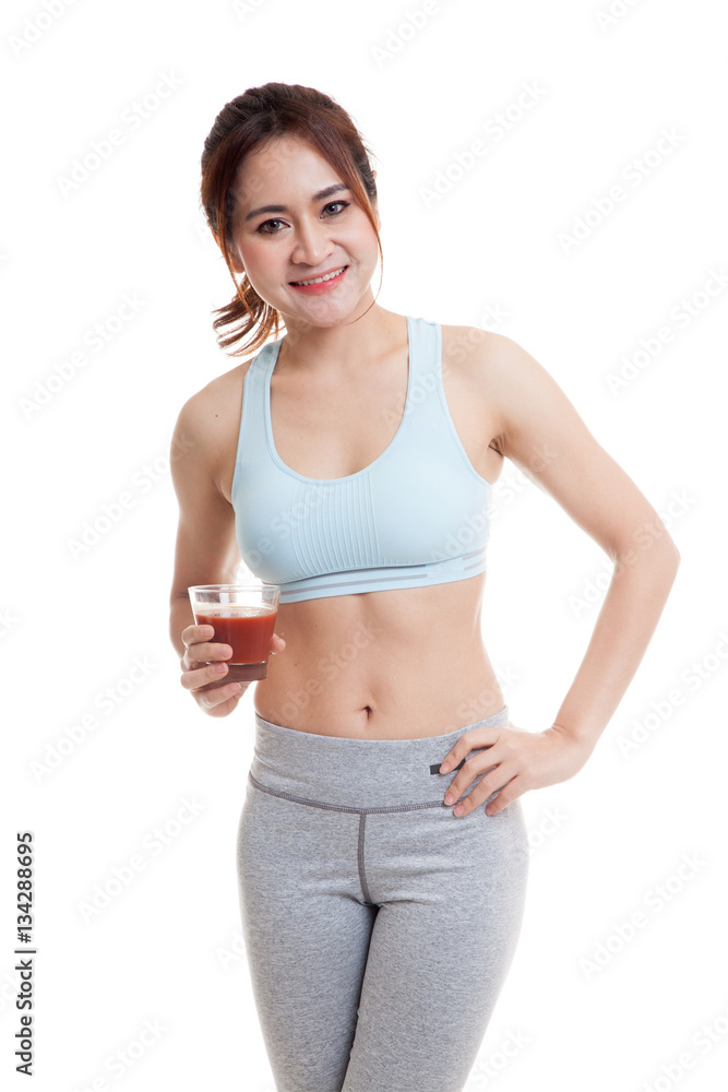 Beautiful healthy Asian girl with tomato juice.