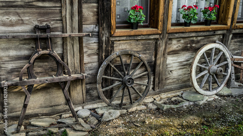 old wooden parts of wagon standing near the house