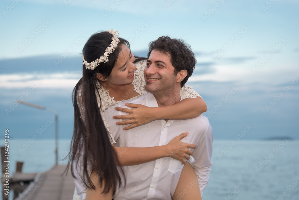 Young love Couple smiling under blue sky