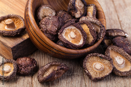 dried shitake mushroom on a wooden table
