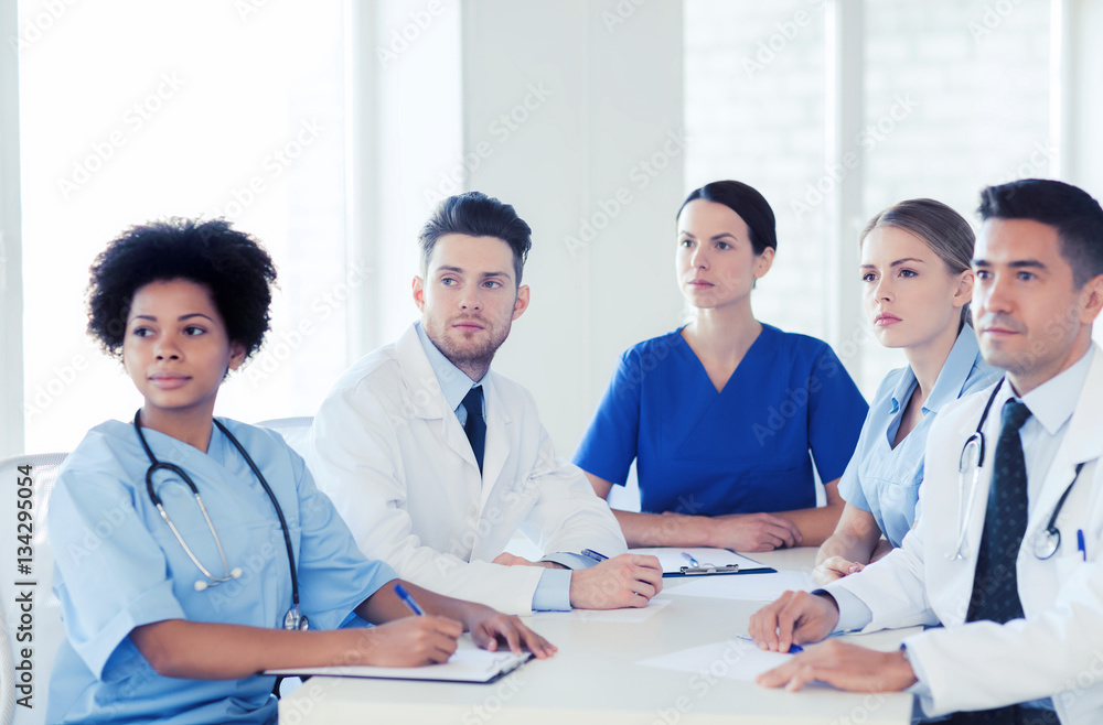 group of happy doctors on conference at hospital group of happy doctors on conference at hospital