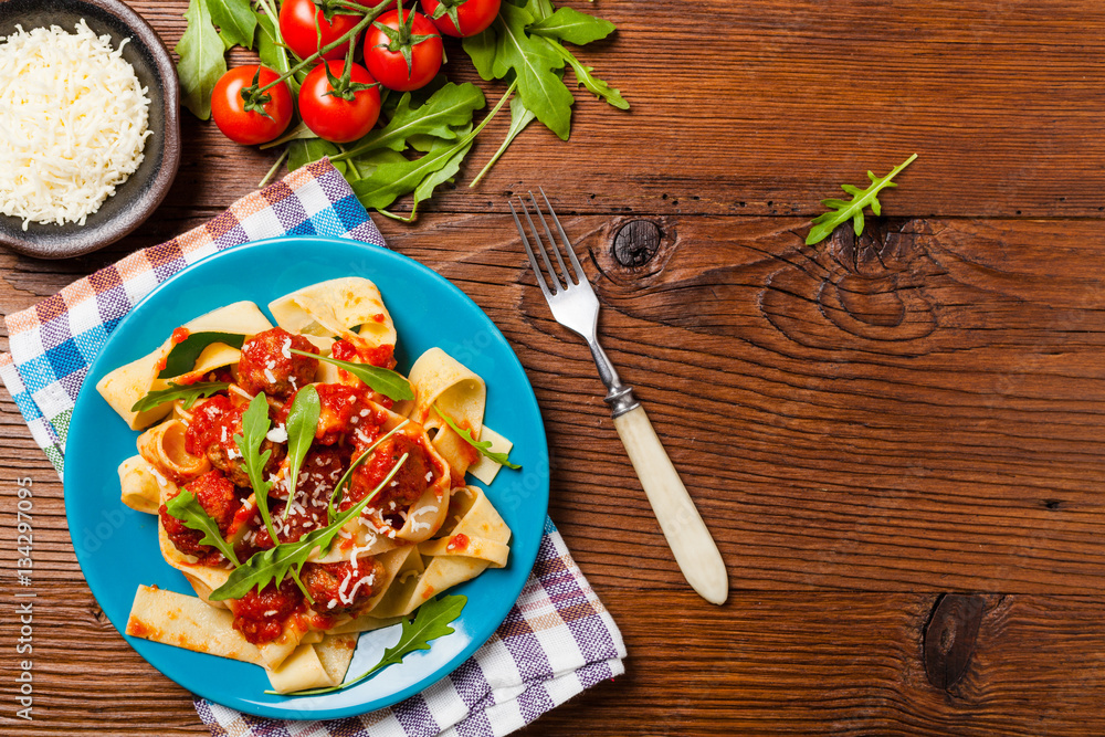 Italian pasta pappardelle with meatballs in tomato sauce. Italian pasta pappardelle with meatballs in tomato sauce.