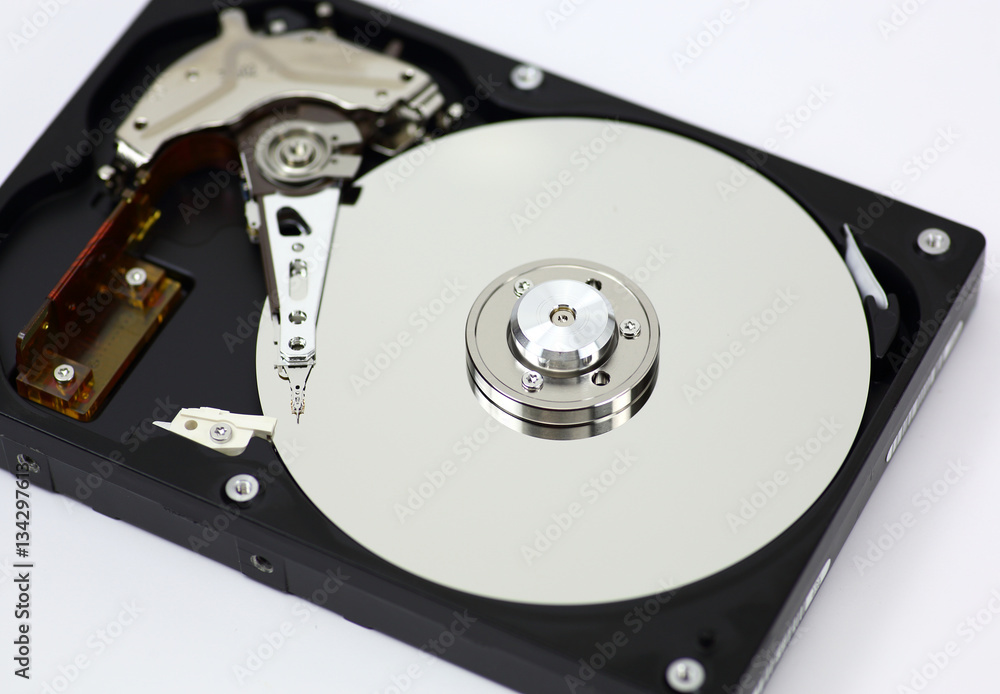 Harddisk drive (HDD) with top cover open isolated on white background Harddisk drive (HDD) with top cover open isolated on white background