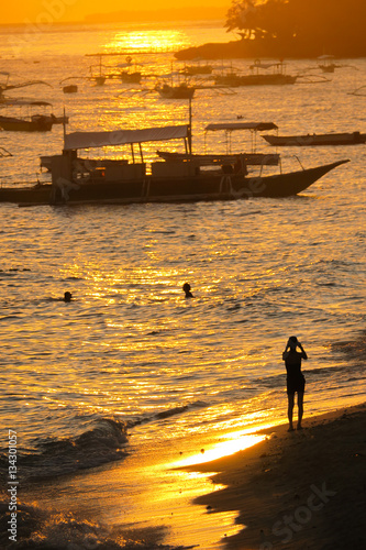 Traveler Taking a Photo of Alona Beach - Panglao, Philippines photo