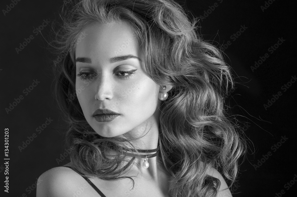 luxury woman with curly long hair on black background, monochrome luxury woman with curly long hair on black background, monochrome