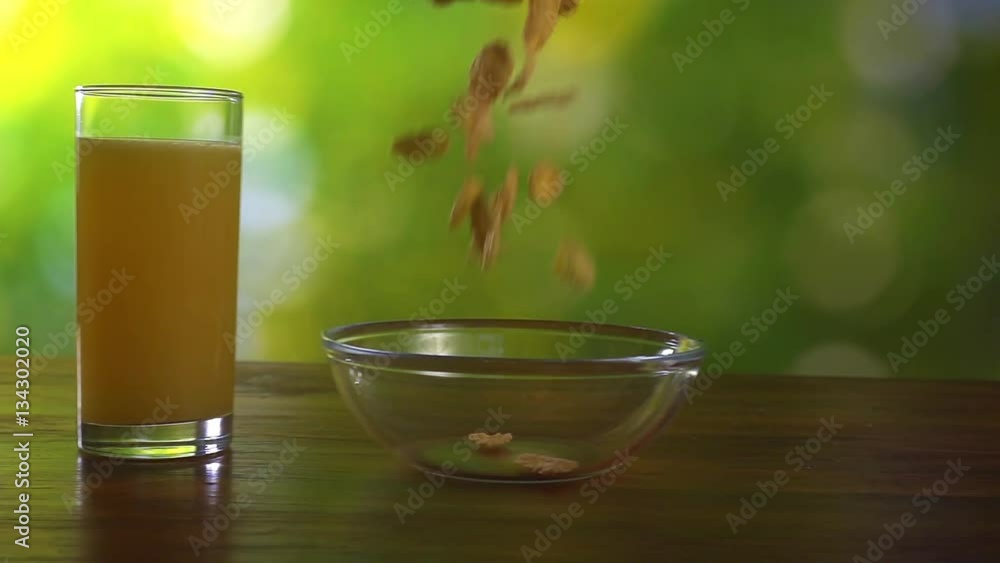 Cereal flakes falling in a glass bowl, slow motion hd video Cereal flakes falling in a glass bowl, slow motion hd video