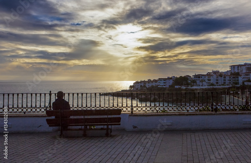 Man sitting at Balcon de Europa, Nerja, Spain © WH_Pics