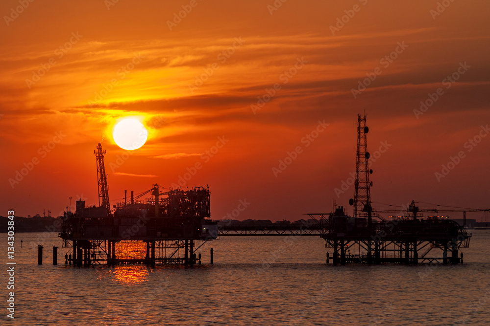 Oil platform silhouette in gulf of mexico Oil platform silhouette in gulf of mexico