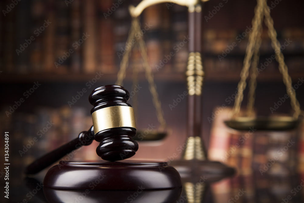 Law theme, mallet of the judge, wooden desk, books Law theme, mallet of the judge, wooden desk, books