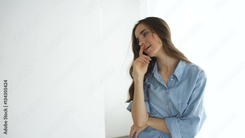 Professional fashion model posing and looking into camera. Woman show poses and emotions Professional fashion model posing and looking into camera. Woman show poses and emotions