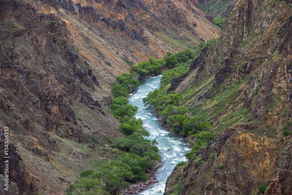 River in Charyn canyon and cloudly sky, Kazakhstan