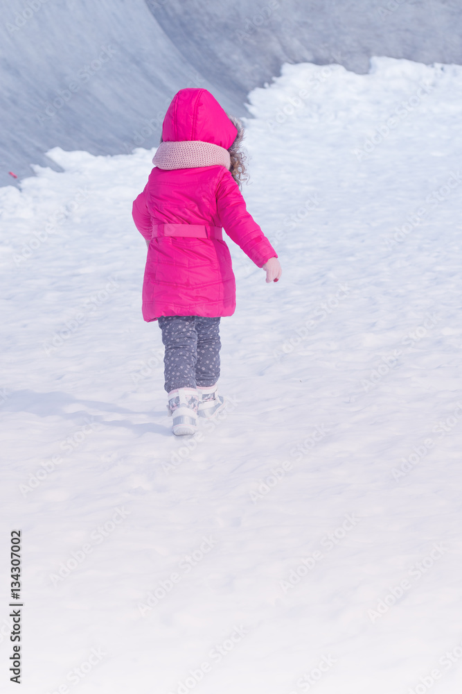 Little Cute sweet girl outdoor playing in winter snow park Little Cute sweet girl outdoor playing in winter snow park
