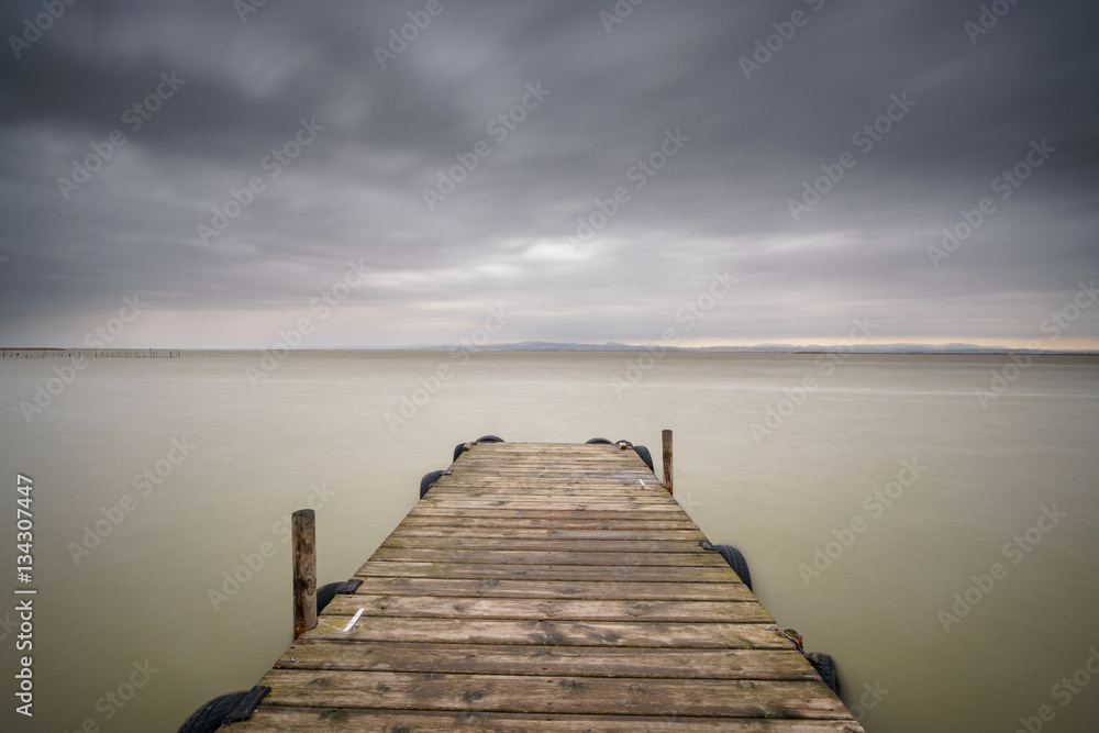 Storm over Albufera with wooden pier, Valencia