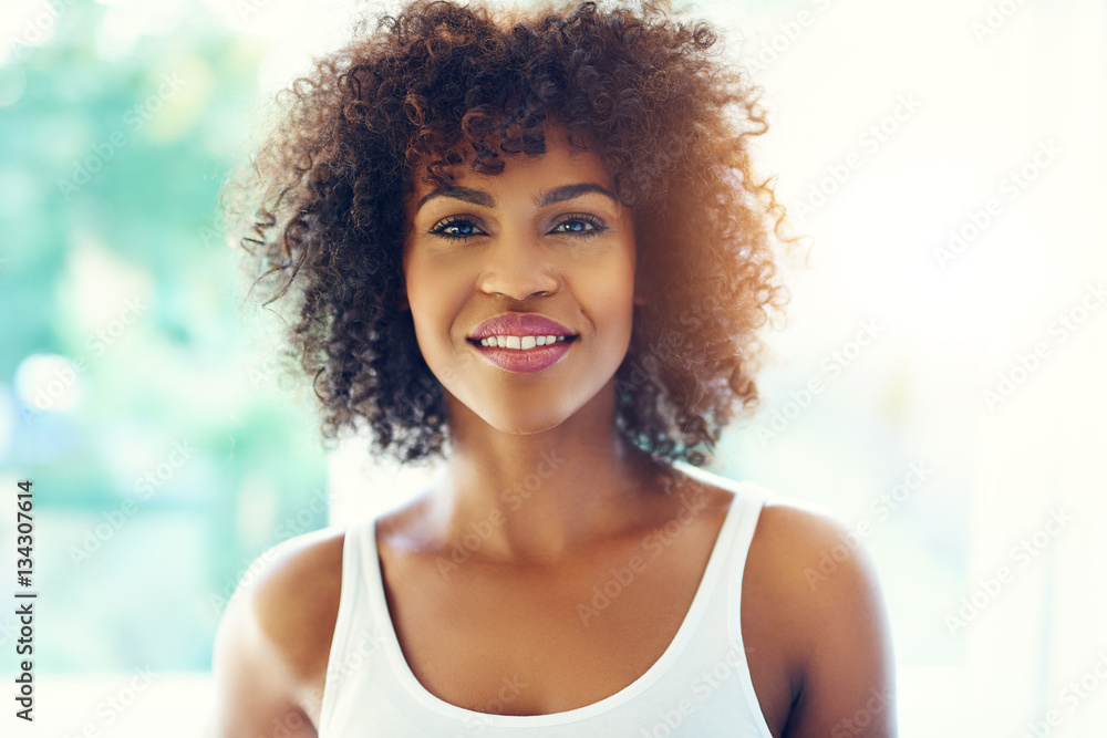 Portrait of smiling young black woman in sunshine Portrait of smiling young black woman in sunshine