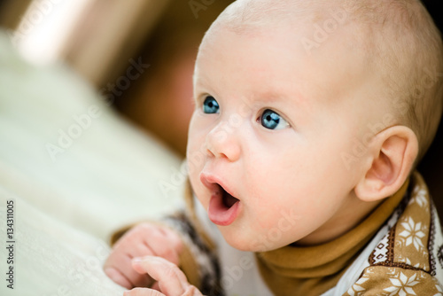 cute little baby girl with amazement on her face photo