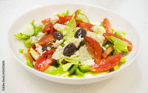 Greek salad with tomatoes, feta cheese and olives