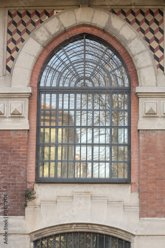 large decorated window at historical factory  Crespi on Adda  It
