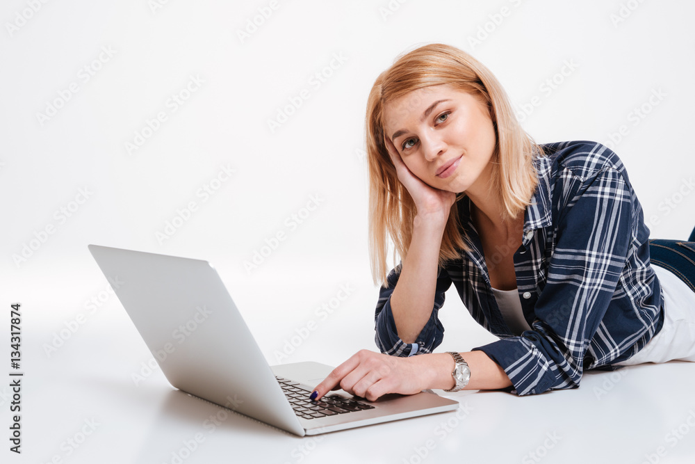 Pretty young woman using laptop computer Pretty young woman using laptop computer