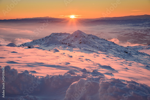 Frosty sunset at an amazing location - beautiful winter landscape on a mountain top © photoenthusiast