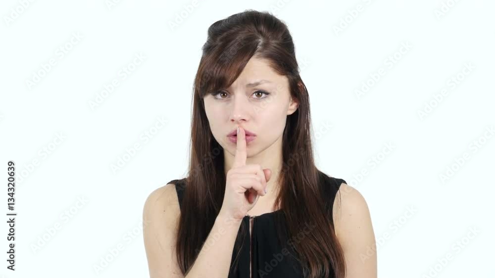 Gesture of Silence by Young Girl, Finger on Lips Gesture of Silence by Young Girl, Finger on Lips
