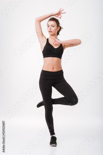 Beautiful young fitness woman make yoga exercises