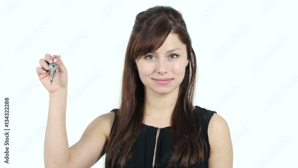 Young Girl Showing House Keys, White Background Young Girl Showing House Keys, White Background