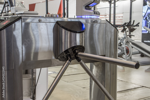 The tripod turnstile with electronic card reader is closed