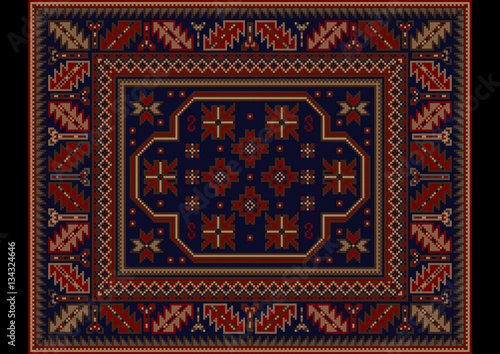 Vintage carpet with  ethnic ornament in burgundy and dark blue colors

