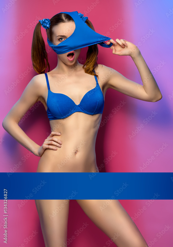 Young woman posing in bikini without panties, bottom of bikini on head  Stock Photo | Adobe Stock