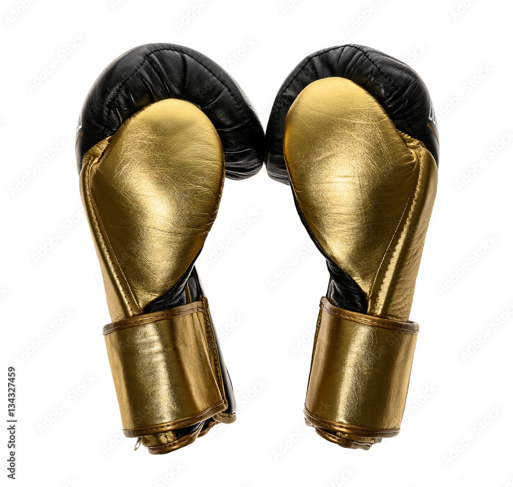 Golden and black leather leather boxing gloves isolated on white Golden and black leather leather boxing gloves isolated on white